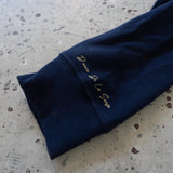 Donce de la Sense Polo Long Sleeve, featuring a meticulously finished front placket and handprinted details on the necktag and sleeve.
